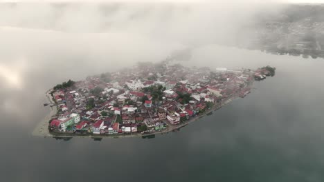 low clouds at isla de flores guatemala during a magical morning, aerial