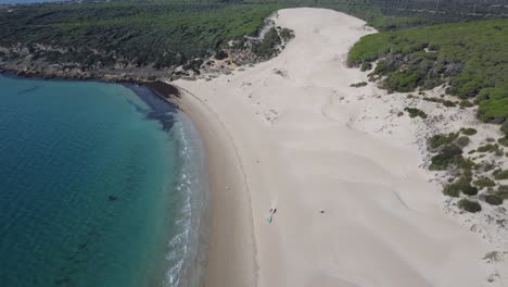 drone flies towards the famous dune of bolonia north of tarifa in spain, sunny weather