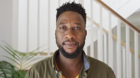 Portrait-of-african-american-man-looking-at-camera-and-smiling