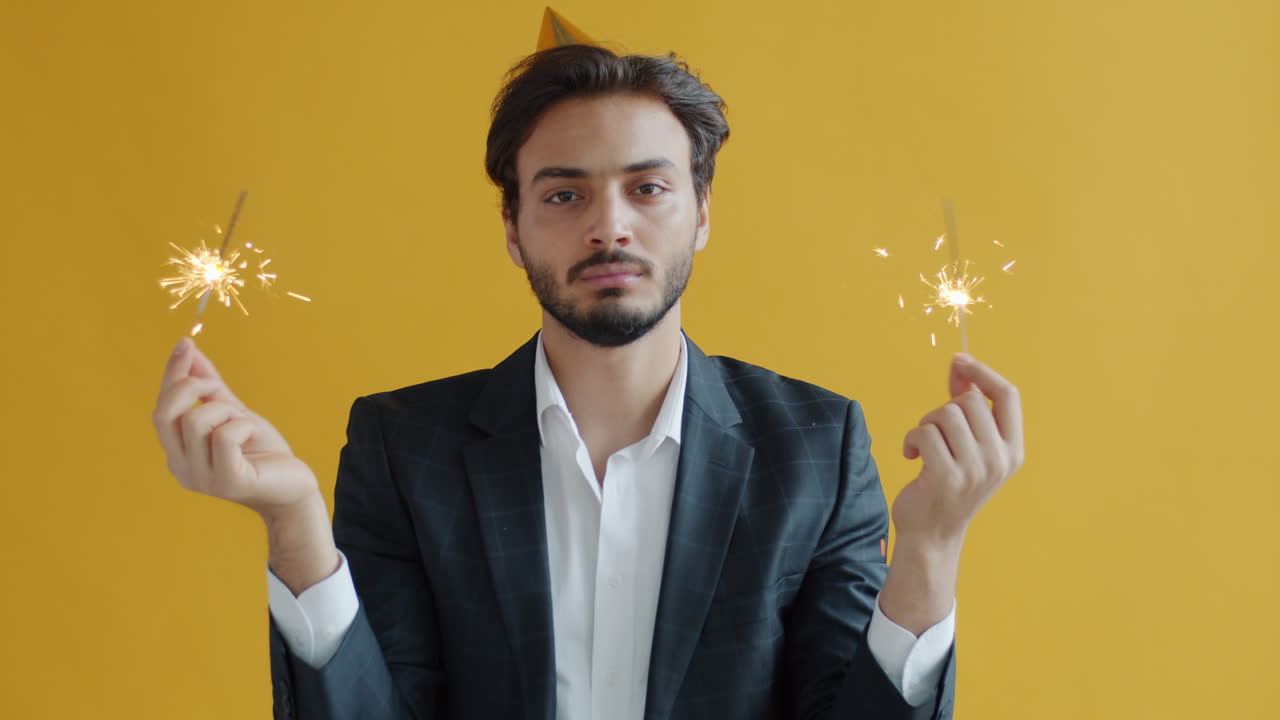Man Celebrating with Sparklers