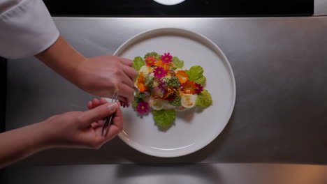 chef preparing a floral edible arrangement