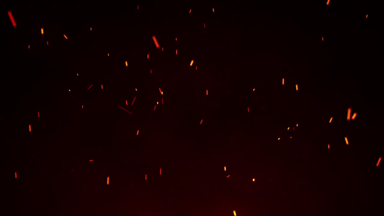 Floating Sparks in Dark Background