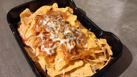 nachos with cheese sauce_close up shot