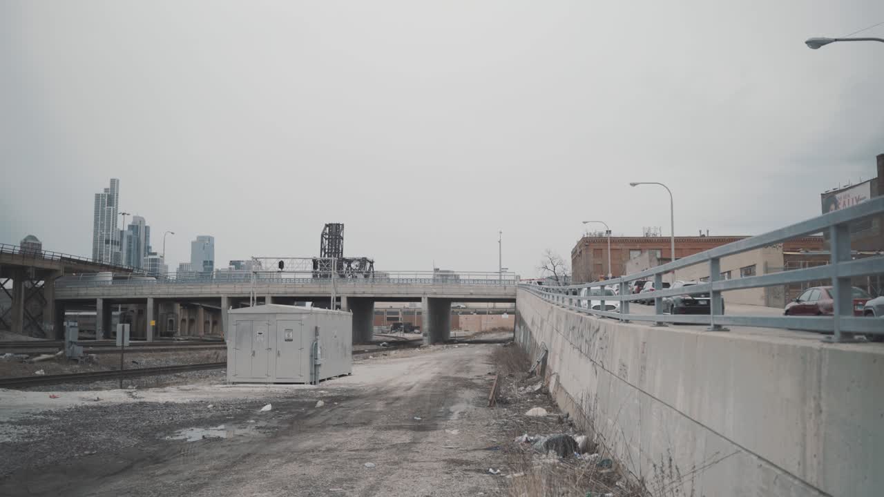 Gloomy Cityscape: Urban Landscape with Railroad Tracks and Overpass