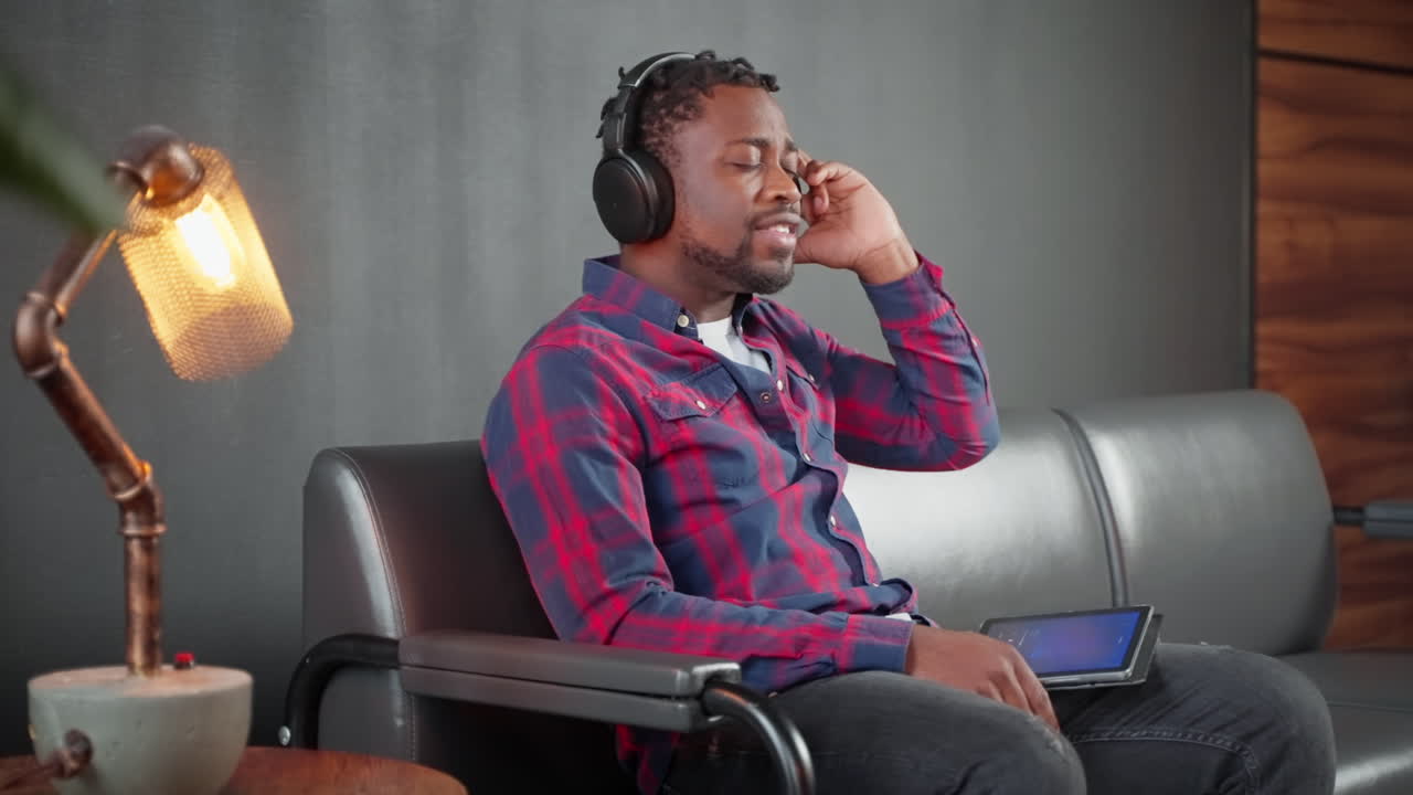 Man Listening to Music on Headphones