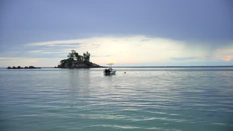 Seychelles-footage-from-the-main-island-Mahe-filmed-on-a-beach-with-a-camera-filming-sea,-beach,-boat-with-smooth-movement