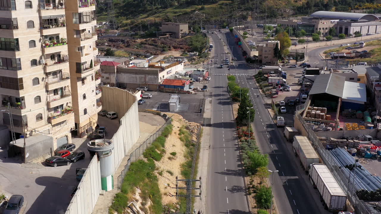 Security wall with Israeli idf watch tower Close to Shuafat Refugee Camp- Aerial