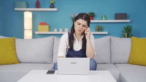 Woman-looking-at-laptop-is-thoughtful.