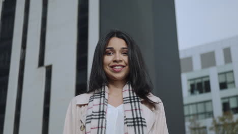 happy businesswoman looking at camera on street. business lady smiling outdoors