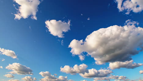 blue sky with fluffy cumulus clouds