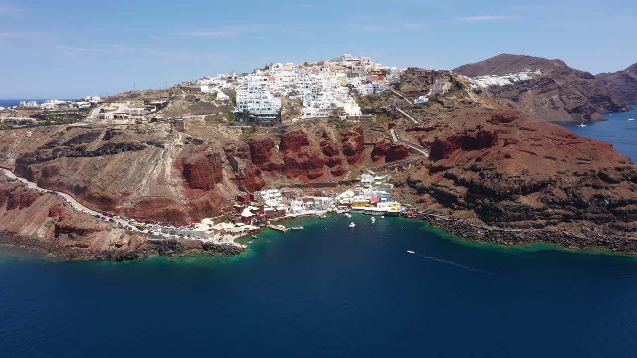 Monolíthou Marina On Sheer Rock Face Sea Cliffs In Mediterranean Sea, Santorini, Greece. Aerial Drone Shot