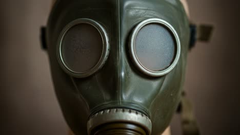 close-up of an antique gas mask displaying its intricate design and unique features, capturing the essence of historical protective gear in a stylized presentation