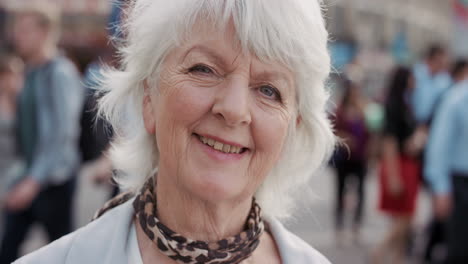 slow motion portrait of happy mature old woman smiling