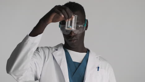 african american doctor on grey background.