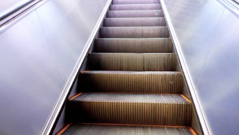 close up of moving empty escalator in operation, 4k footage, nobody.