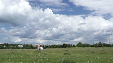 young mother walking with buggy