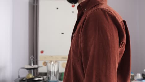 man folding his shirt sleeve