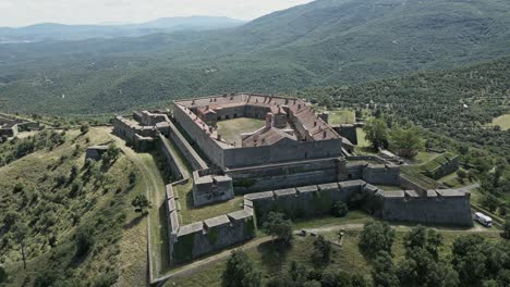 aerial circling bellegarde fort on sunny day, le perthus, france