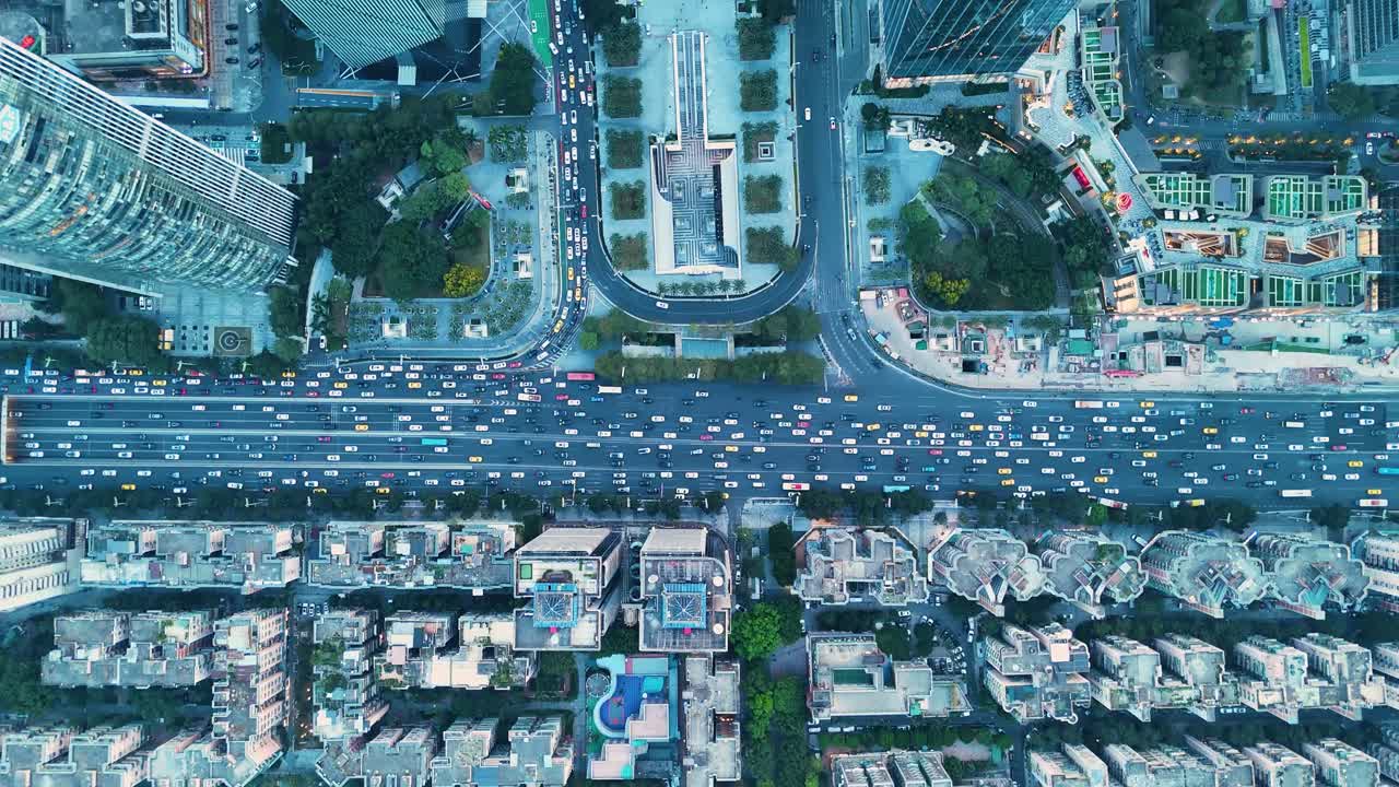 Top-down drone shot of traffic at Huacheng Square at sunset in Guangzhou City Center in Guangdong, China