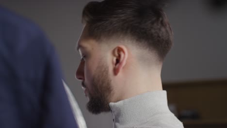 young man at home choosing business suit from wardrobe for job interview 5