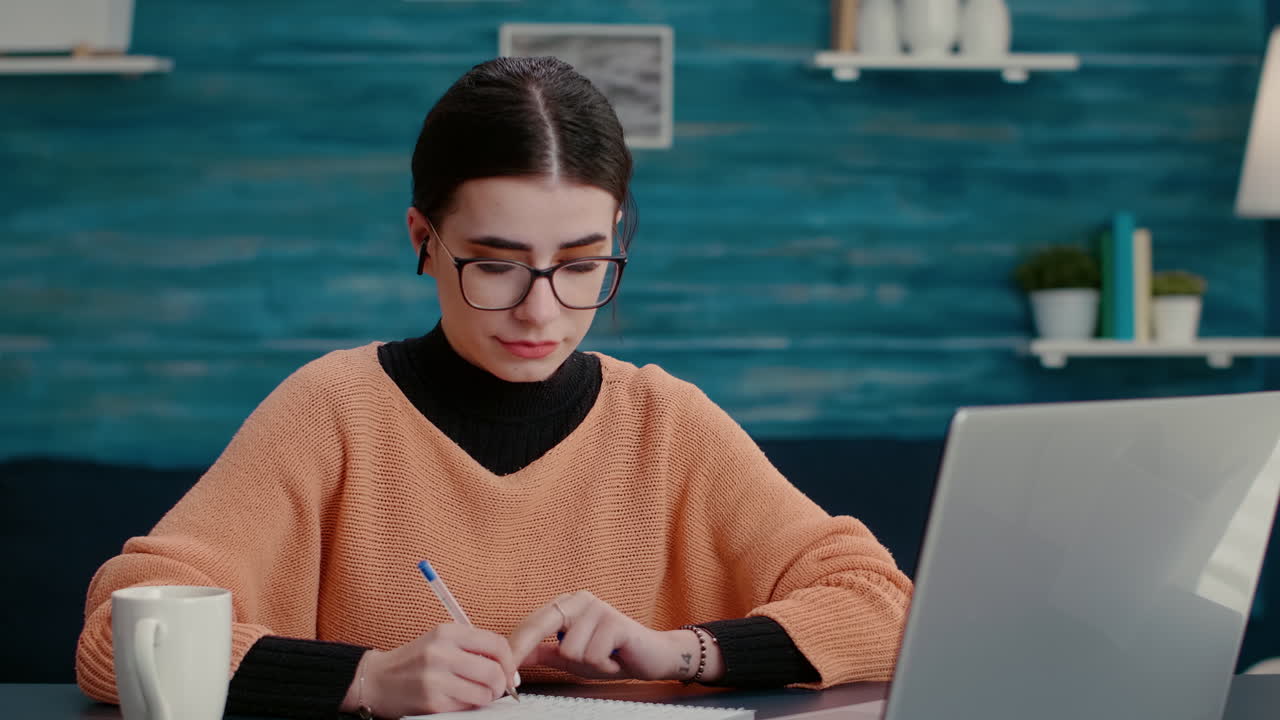 University student attending online class on videoconference