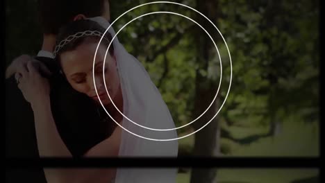 Animation-of-camera-interface-with-lens-over-happy-bride-and-groom-on-wedding-day