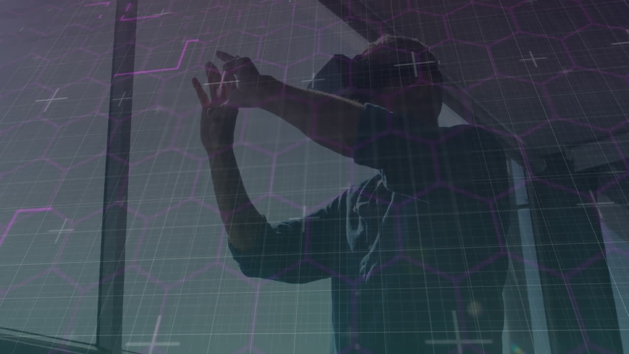 Hexagonal shapes and data processing against caucasian man wearing vr headset at office