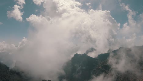 epic aerial over beautiful cloudy volcanic mountains