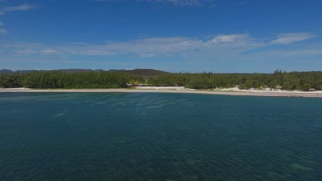 aerial view over clear blue water along the beach at sakalava bay, madagascar