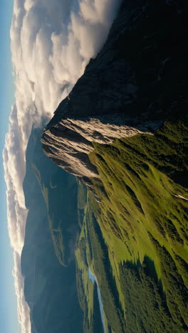 majestic mountain landscape with clouds and green valley