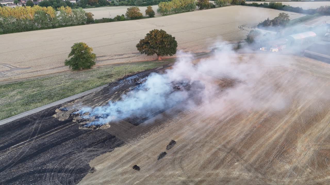 Farm Fields on Fire Essex UK fire engine attending hot sunset drone,aerial