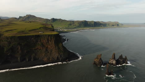 icelandic black sand beach and coastal cliffs