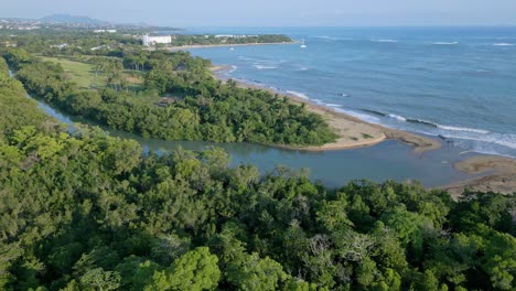 aerial view of mouth of the river of rio munoz and caribbean sea in dominican republic