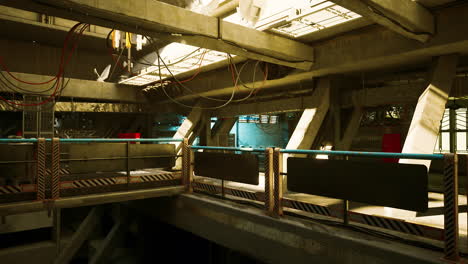 spacious room with metal railing and windows