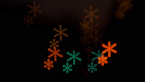 Beautiful-snowflake-bokeh-from-moving-car-and-traffic-lights-at-the-evening,-Christmas,-winter-or-holiday-background-concept,-copyspace