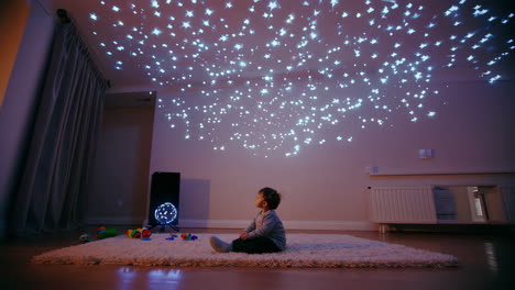 toddler looking at bokeh lights