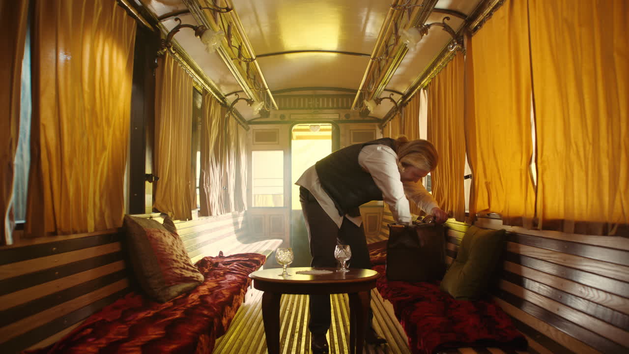 Vintage Train Car Interior with Man Serving Drinks