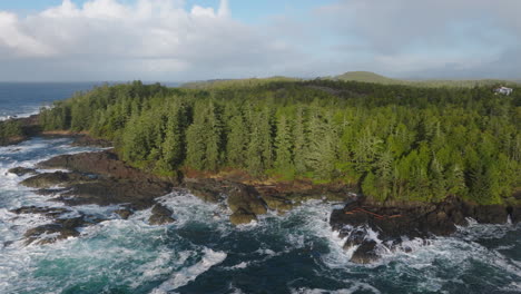 drone video at sunset in ucluelet british columbia, canada over the ocean and forest