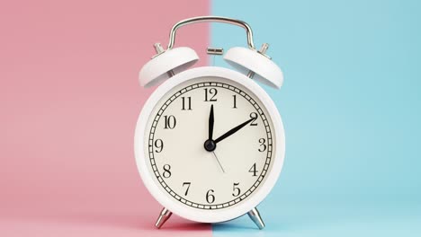 alarm clock isolated on a pink blue background.