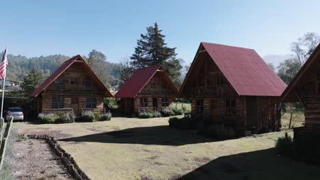 backwards shot of stunning wooden cabins in heart of nature, mexico