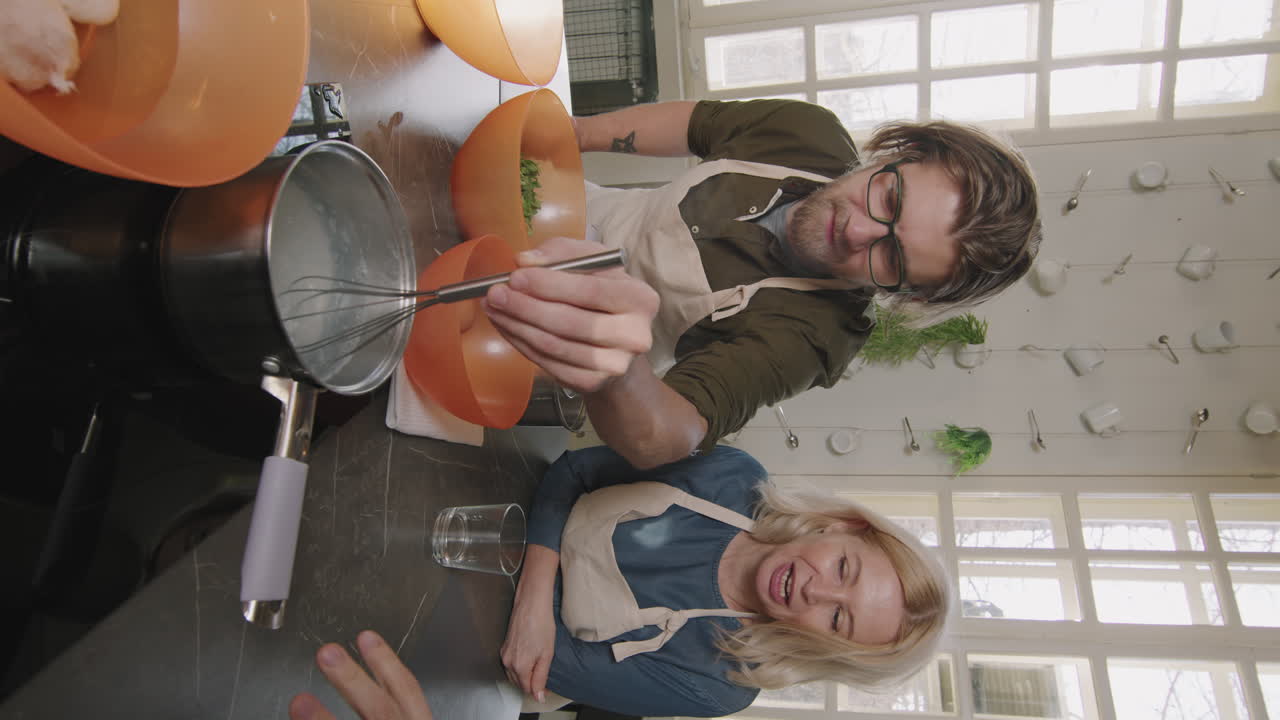 Man And Woman Cooking Poached Egg