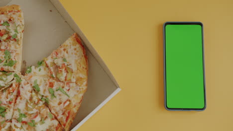 pizza in a box with green screen phone
