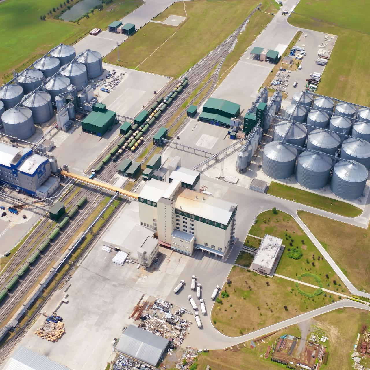 Big territory of farming storage warehouses. Agricultural huge metal factory storages