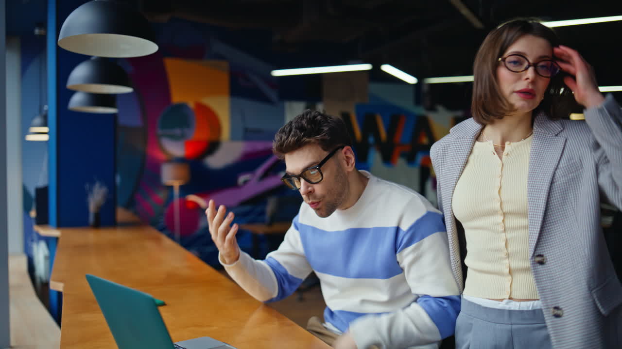Stressed coworkers looking computer screen in office closeup. Team reacting fail