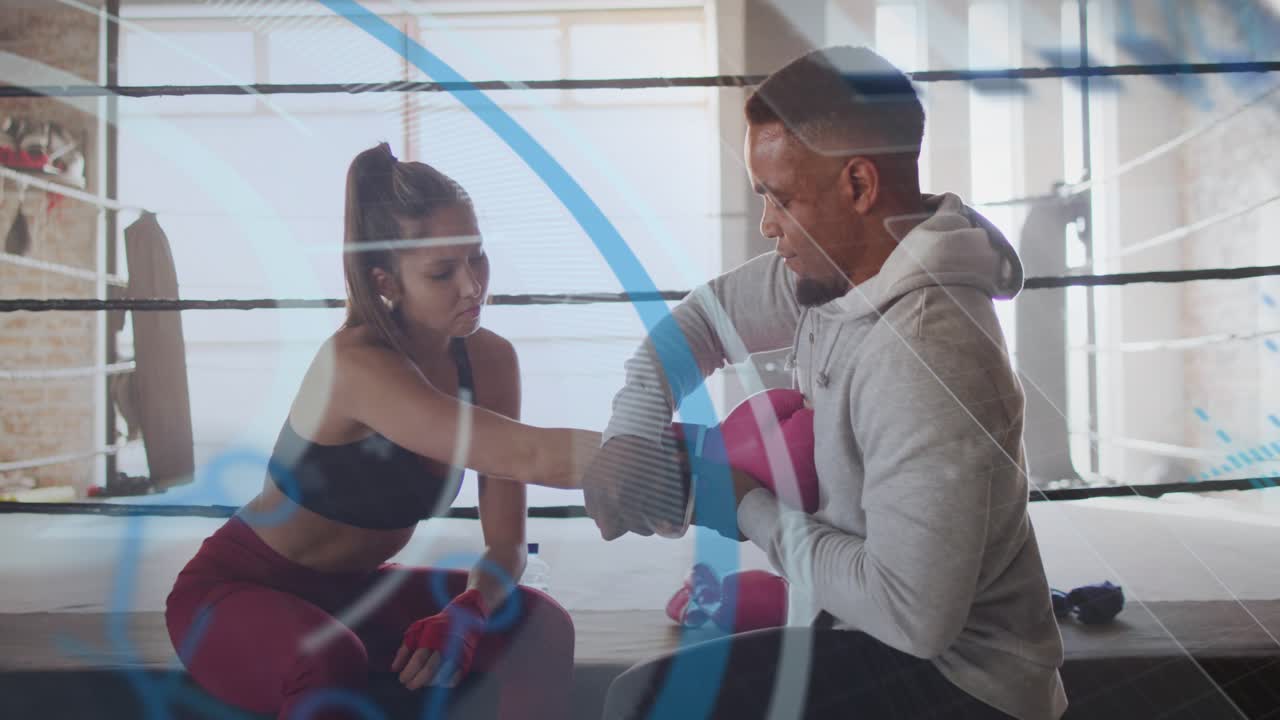 Boxer placing hand into pink mitt, coach securing, lifting pads, blue overlay showing contact prep