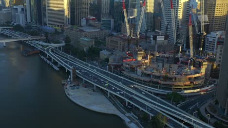 City-View-At-Queens-Wharf-Development-Site-In-Brisbane-With-Rush-Hour-Traffic-At-M3-Road-Corridor-On-A-Sunset