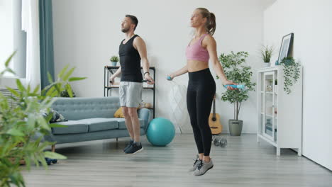couple jumping rope at home workout