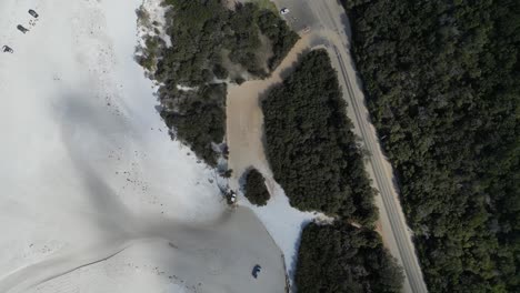 vehicle moving on beach to road, bremer bay in western australia