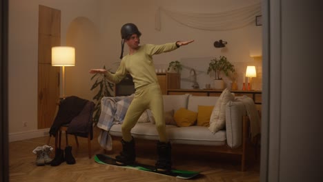 man snowboarding inside at night