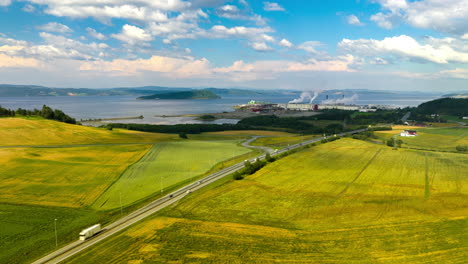 Panoramic-Aerial-View-Of-E6-Thoroughfare-With-Fiborgtangen-Industrial-Site-At-The-Background-In-Trøndelag-County,-Norway